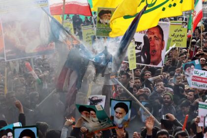 Iranian protesters waving banners in 1979 revolution