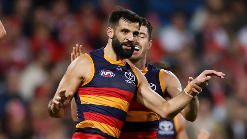 Adelaide Crows players celebrate after dominant 90-point win over Sydney Swans at SCG