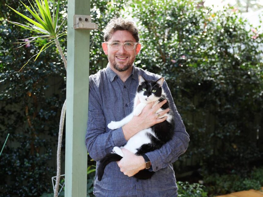 Leo Patterson Ross with his cat Louis in Turramurra home