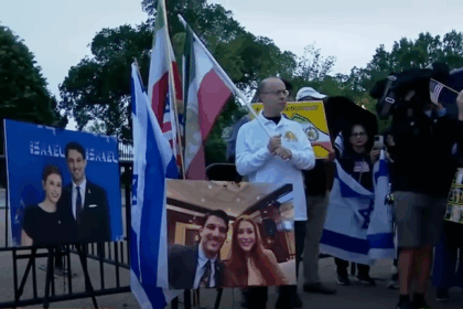 Protesters holding placards calling for justice in Gaza and free speech
