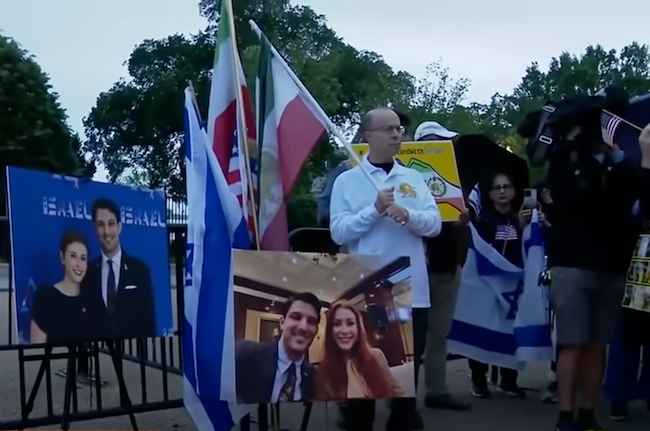Protesters holding placards calling for justice in Gaza and free speech