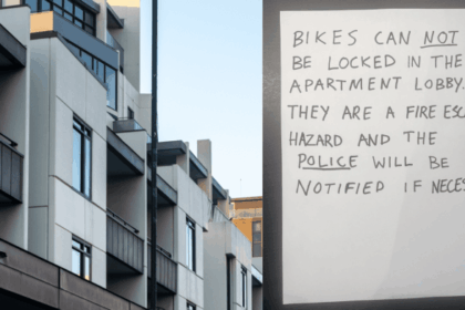 Handwritten strata notice about bike parking in lobby