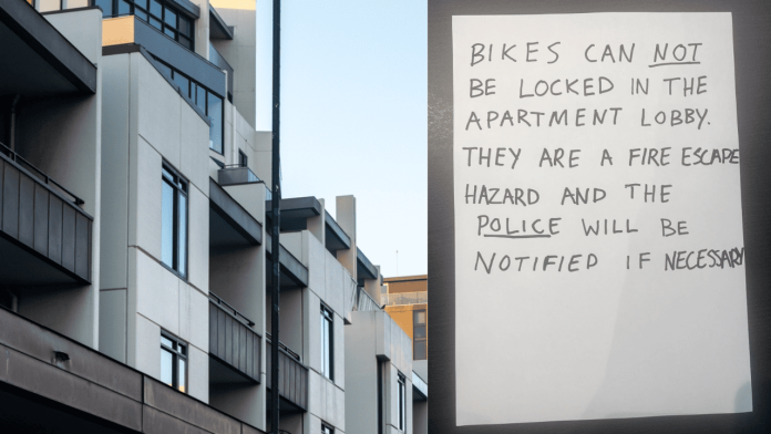 Handwritten strata notice about bike parking in lobby