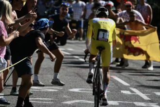 Slovenian rider Tadej Pogačar wearing the overall leader's yellow jersey cycles during the 13th stage of the 112th edition of the Tour de France cycling race. Source: AFP / Marco Bertorello