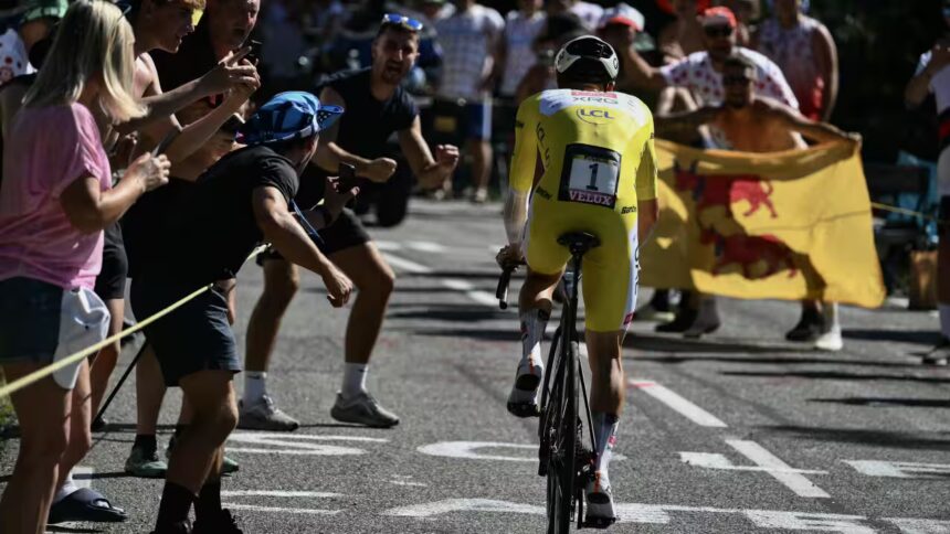 Slovenian rider Tadej Pogačar wearing the overall leader's yellow jersey cycles during the 13th stage of the 112th edition of the Tour de France cycling race. Source: AFP / Marco Bertorello